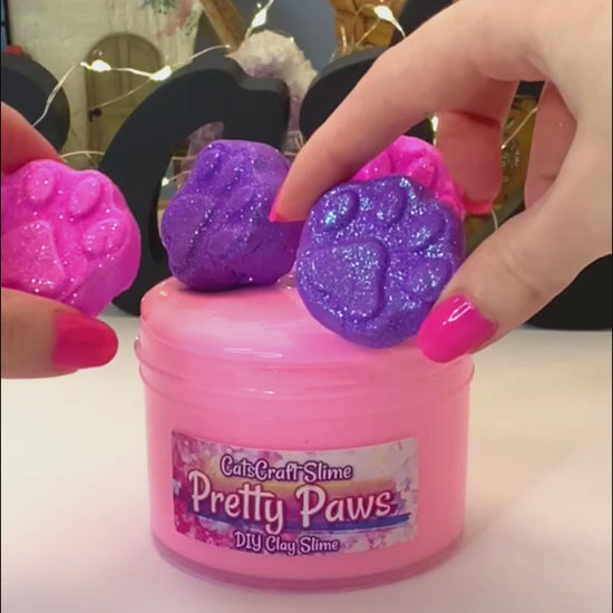 pretty paws slime video mixing clay paw prints into the thick glossy slime