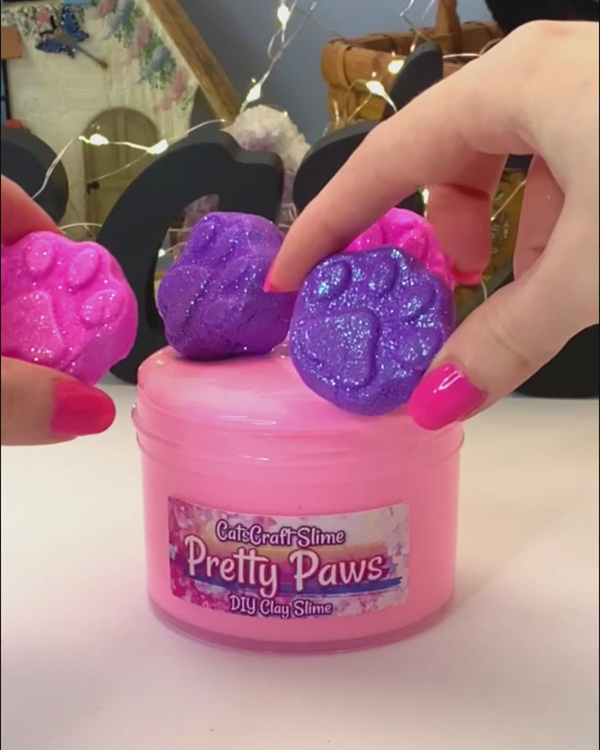 pretty paws slime video mixing clay paw prints into the thick glossy slime